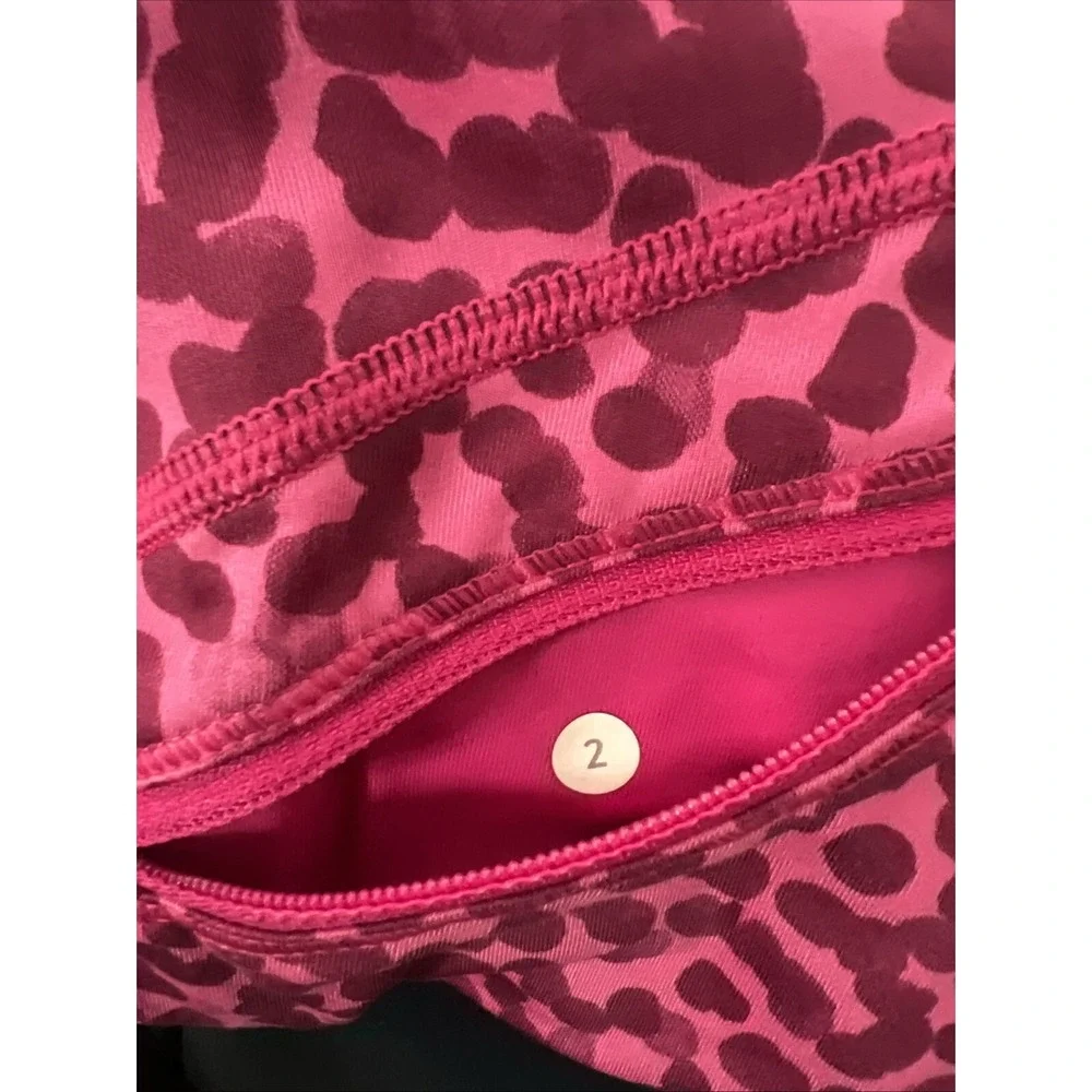 Women's Lululemon Sz 4 Speed Crop Legging animal print Magenta Purple Pocket